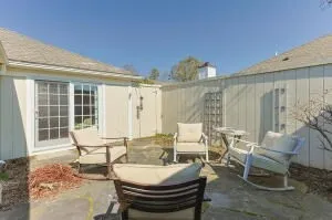 a outdoor space with patio the couches and a dining table with garden view