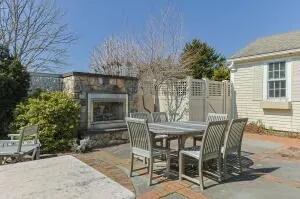 a view of a patio with table and chairs and potted plants