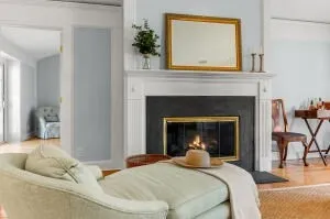 a bedroom with a bed and a fireplace