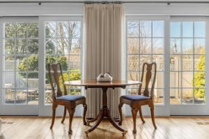 1114 Orleans Road, Unit 2 Chatham, MA 02650 - Photo 7 of 38 a dining room with furniture and floor to ceiling windows