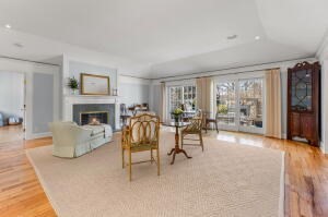 1114 Orleans Road, Unit 2 Chatham, MA 02650 - Photo 8 of 38 a living room with furniture and a fireplace