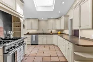a kitchen with a sink stove and cabinets