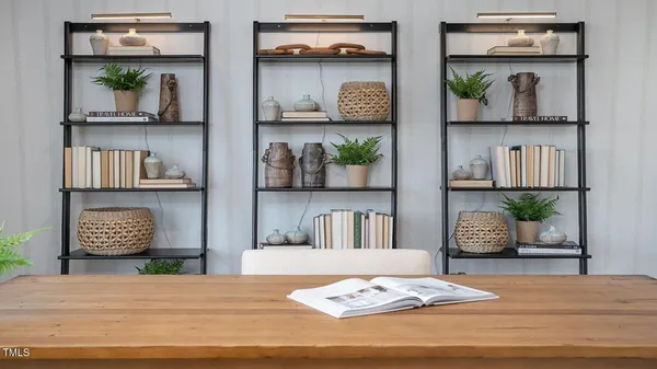 a bedroom with bed and wooden floor