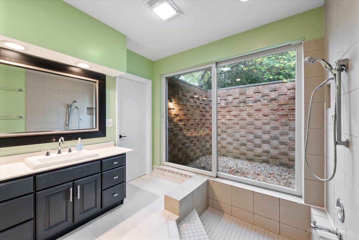 239 Beverly Road Barrington, IL 60010 - Photo 15 of 28 a bathroom with a double vanity sink mirror and shower