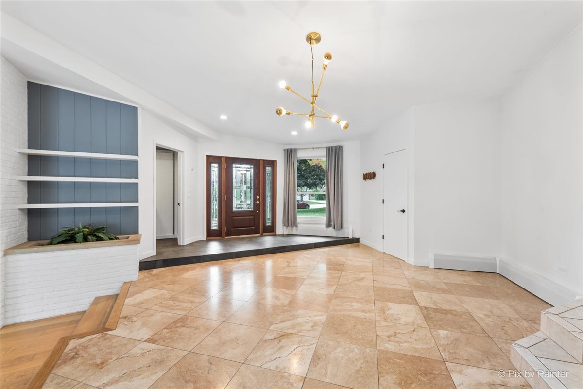 239 Beverly Road Barrington, IL 60010 - Photo 4 of 28 a view of an empty room with window and cabinet