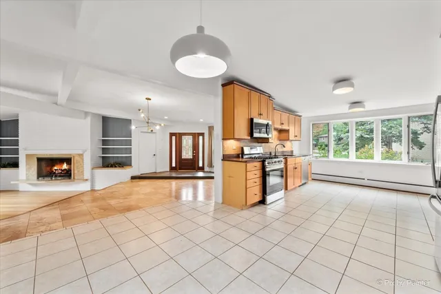 a view of kitchen with furniture and fireplace