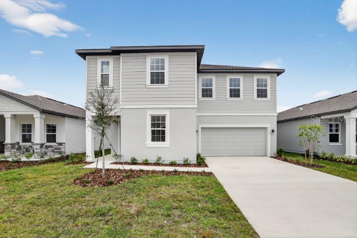 5765 Haystack Drive St. Cloud, FL 34771 - Photo 1 of 42 a front view of house with yard