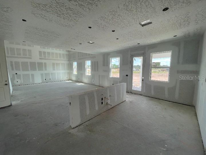 5765 Haystack Drive St. Cloud, FL 34771 - Photo 13 of 42 an empty room with windows