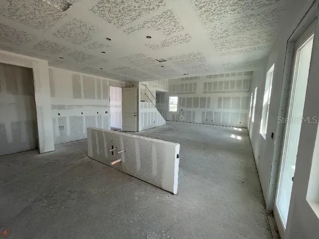 an empty room with a empty space and window