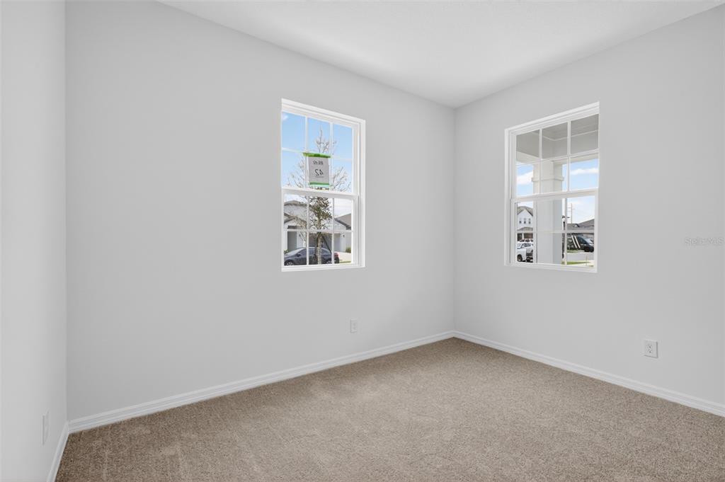 5765 Haystack Drive St. Cloud, FL 34771 - Photo 19 of 42 an empty room with windows
