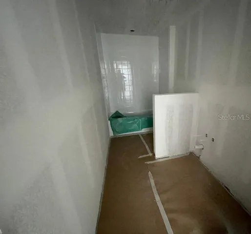 a view of empty room with windows