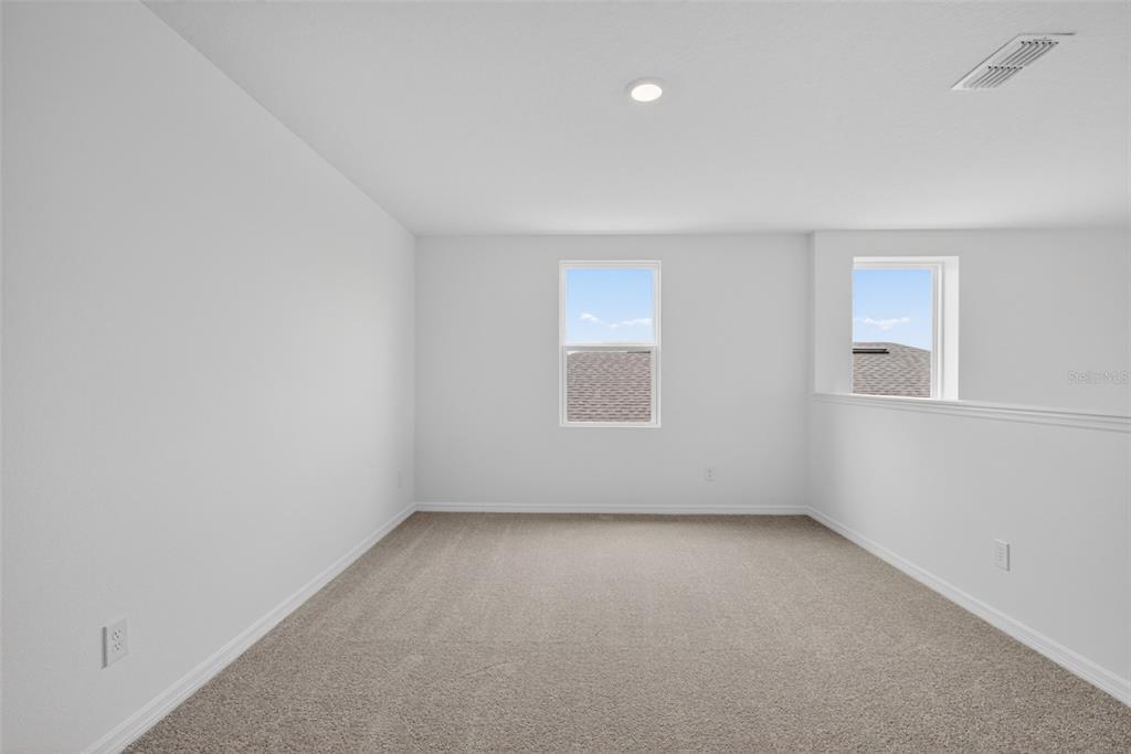 5765 Haystack Drive St. Cloud, FL 34771 - Photo 23 of 42 an empty room with a window