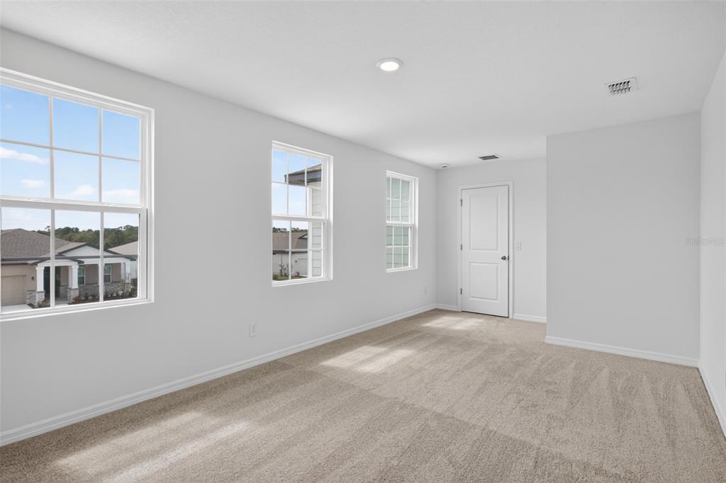 5765 Haystack Drive St. Cloud, FL 34771 - Photo 24 of 42 a view of an empty room with a window