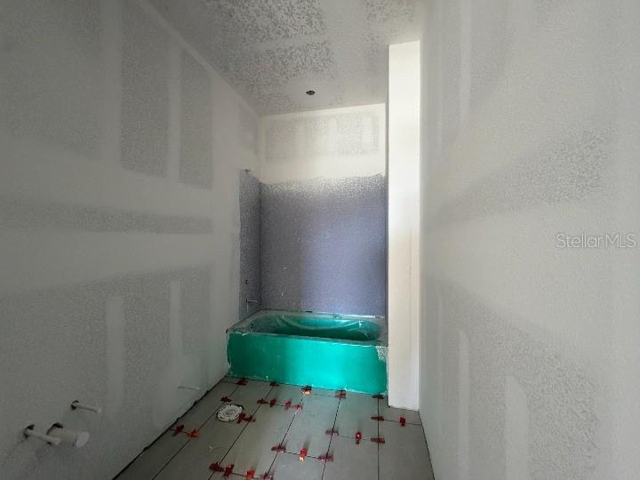 5765 Haystack Drive St. Cloud, FL 34771 - Photo 26 of 42 a bathroom with a sink and mirror