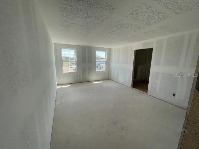 en empty room with windows