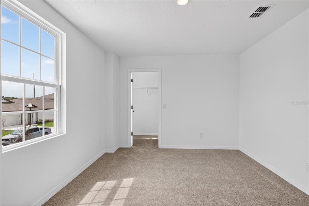 5765 Haystack Drive St. Cloud, FL 34771 - Photo 30 of 42 a view of an empty room with a window