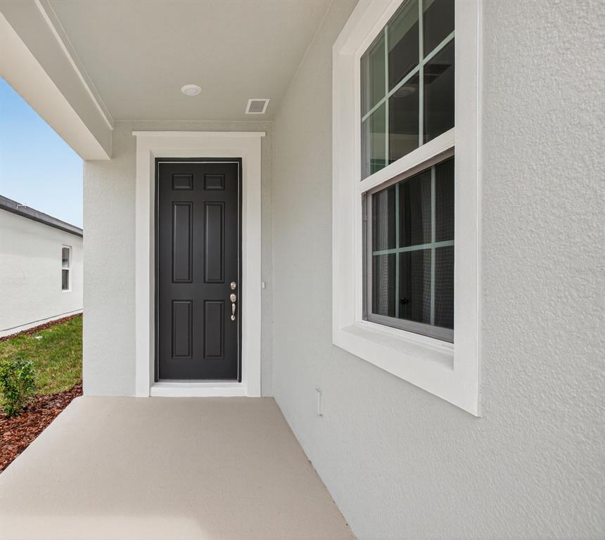 5765 Haystack Drive St. Cloud, FL 34771 - Photo 3 of 42 a view of an empty room with a window