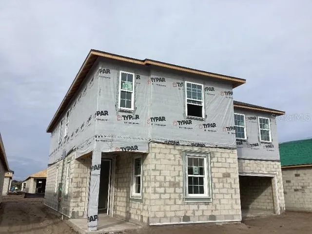 a front view of a house with garage