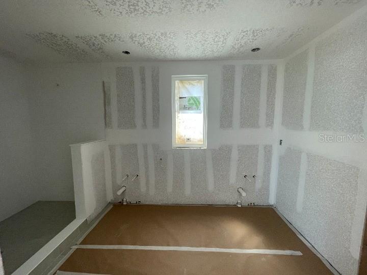 5765 Haystack Drive St. Cloud, FL 34771 - Photo 32 of 42 a view of a room with rack on the wall and a window