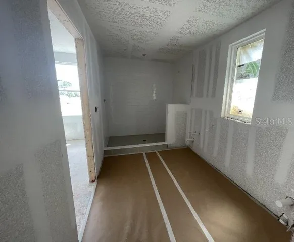 a view of an empty room with a window