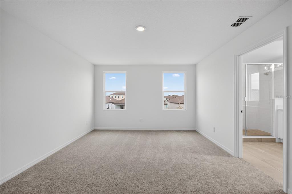 5765 Haystack Drive St. Cloud, FL 34771 - Photo 33 of 42 an empty room with windows