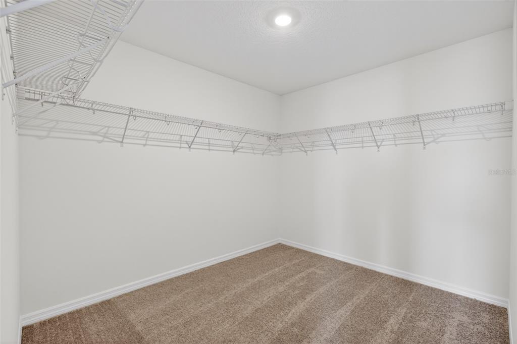 5765 Haystack Drive St. Cloud, FL 34771 - Photo 36 of 42 a view of a room with racks on the wall