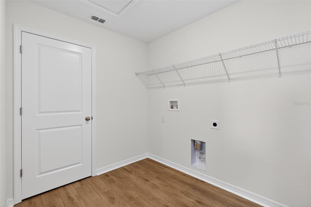 5765 Haystack Drive St. Cloud, FL 34771 - Photo 37 of 42 a view of a small space with wooden floor