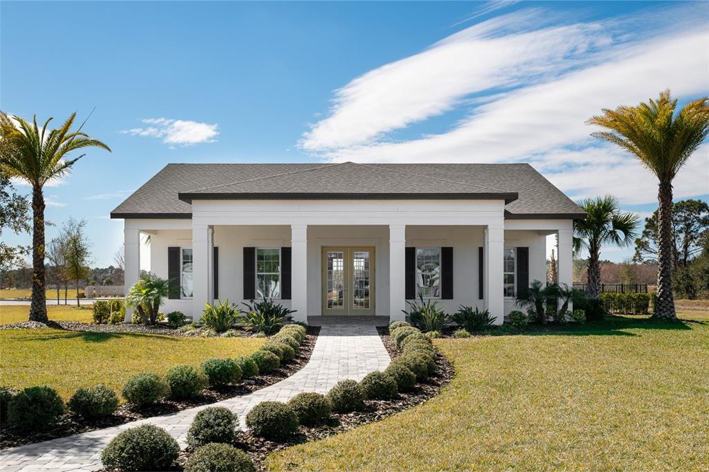 5765 Haystack Drive St. Cloud, FL 34771 - Photo 40 of 42 a front view of a house with swimming pool having outdoor seating