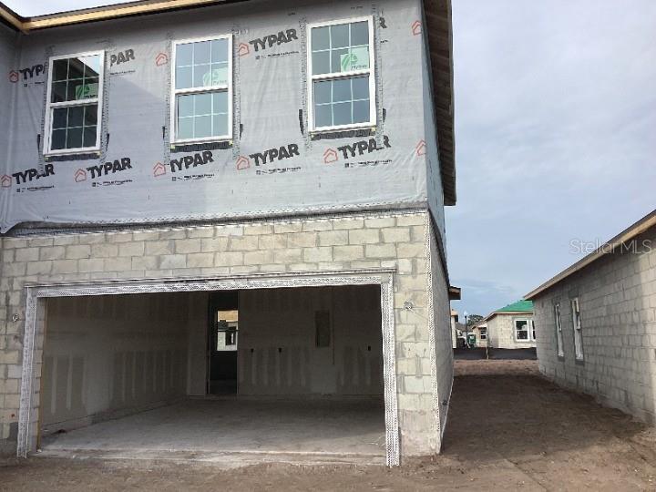 5765 Haystack Drive St. Cloud, FL 34771 - Photo 4 of 42 a front view of a building with glass windows