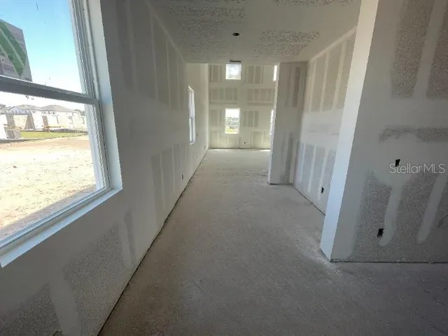a view of a hallway with windows
