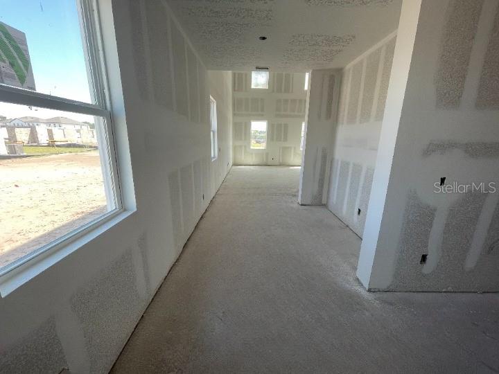 5765 Haystack Drive St. Cloud, FL 34771 - Photo 6 of 42 a view of a hallway with windows