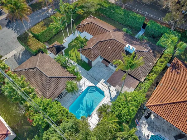 an aerial view of a house with a garden and plants