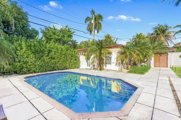 a view of a swimming pool with a patio