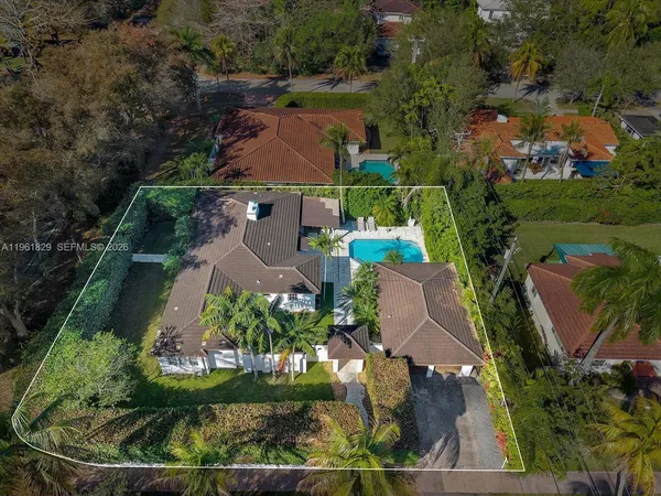 an aerial view of a house with a garden