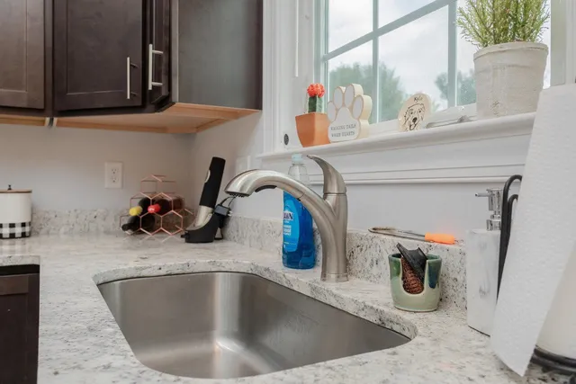 a kitchen with a sink and a window