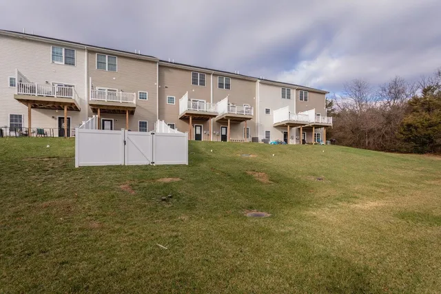 a view of a house with a door and wooden roof