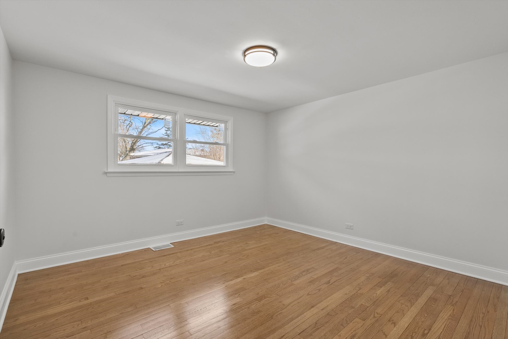 3735 169th Street Country Club Hills, IL 60478 - Photo 9 of 17 wooden floor in an empty room with a window