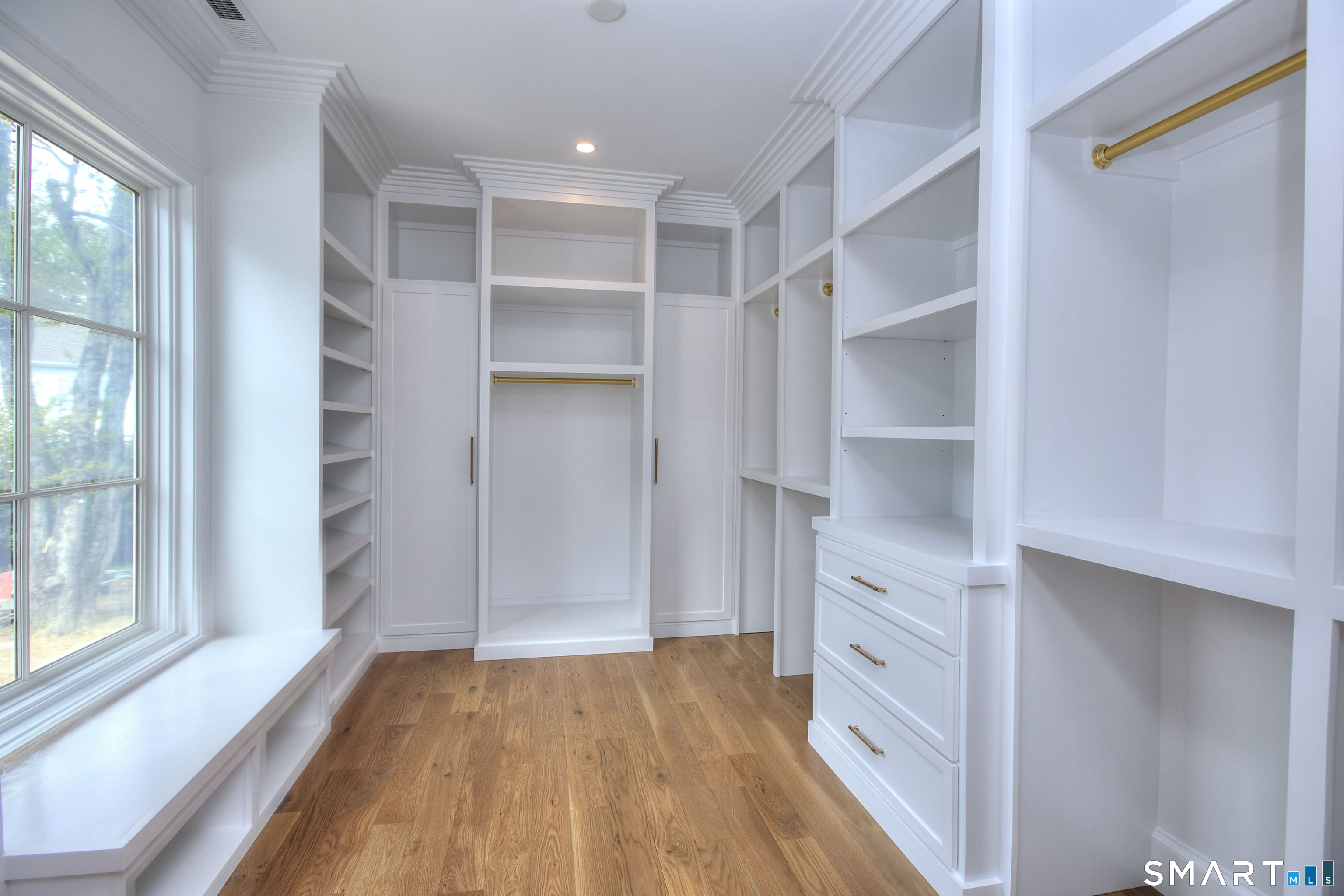 48 Kettle Creek Road Weston, CT 06883 - Photo 27 of 40 a view of walk in closet with empty racks