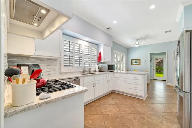 a kitchen with a sink and wooden cabinets