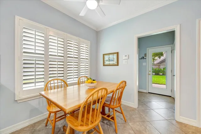 a view of a dining room with furniture and a window