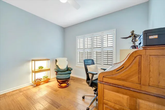 a bedroom with furniture and a window