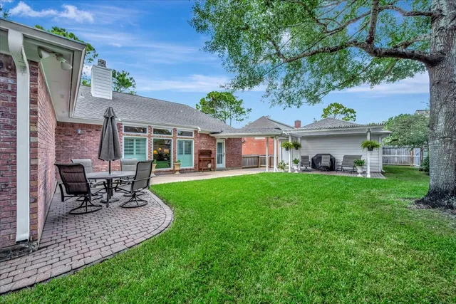 a front view of a house with a garden and porch