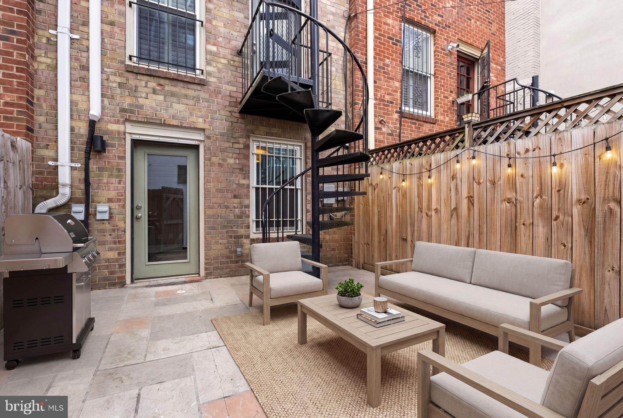 2011 Hillyer Place Northwest Washington, DC 20009 - Photo 12 of 21 a view of a patio with couches table and chairs and potted plants