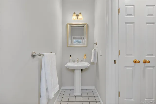 a bathroom with a sink a mirror and a toilet