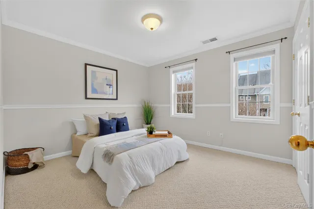 a bedroom with bed and window