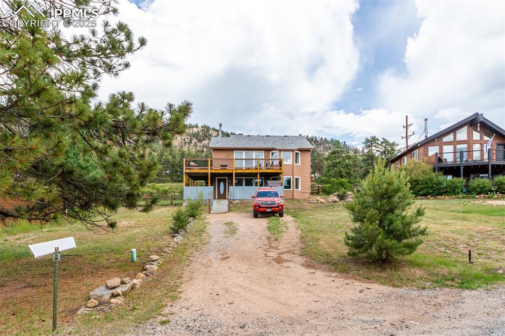 73 Sunlight Lane Bailey, CO 80421 - Photo 29 of 33 View of front of property with driveway
