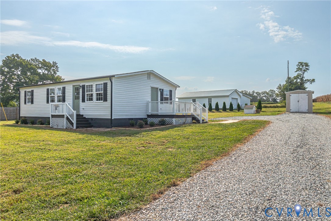 36 Bundick Road Lottsburg, VA 22511 - Photo 45 of 50 White siding residence with dark shutters and a li