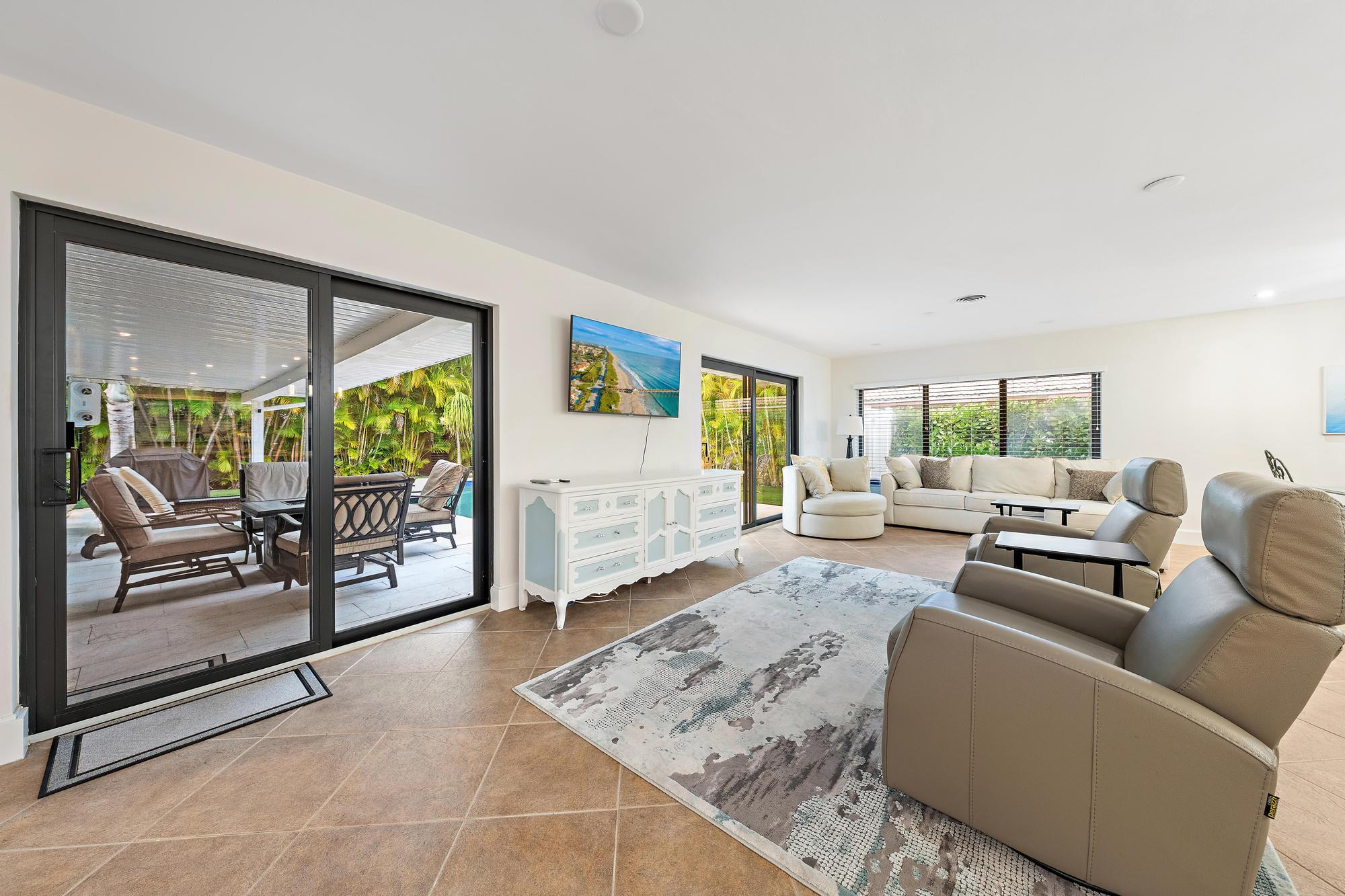 1120 Singer Drive Riviera Beach, FL 33404 - Photo 11 of 37 a living room with furniture and a flat screen tv