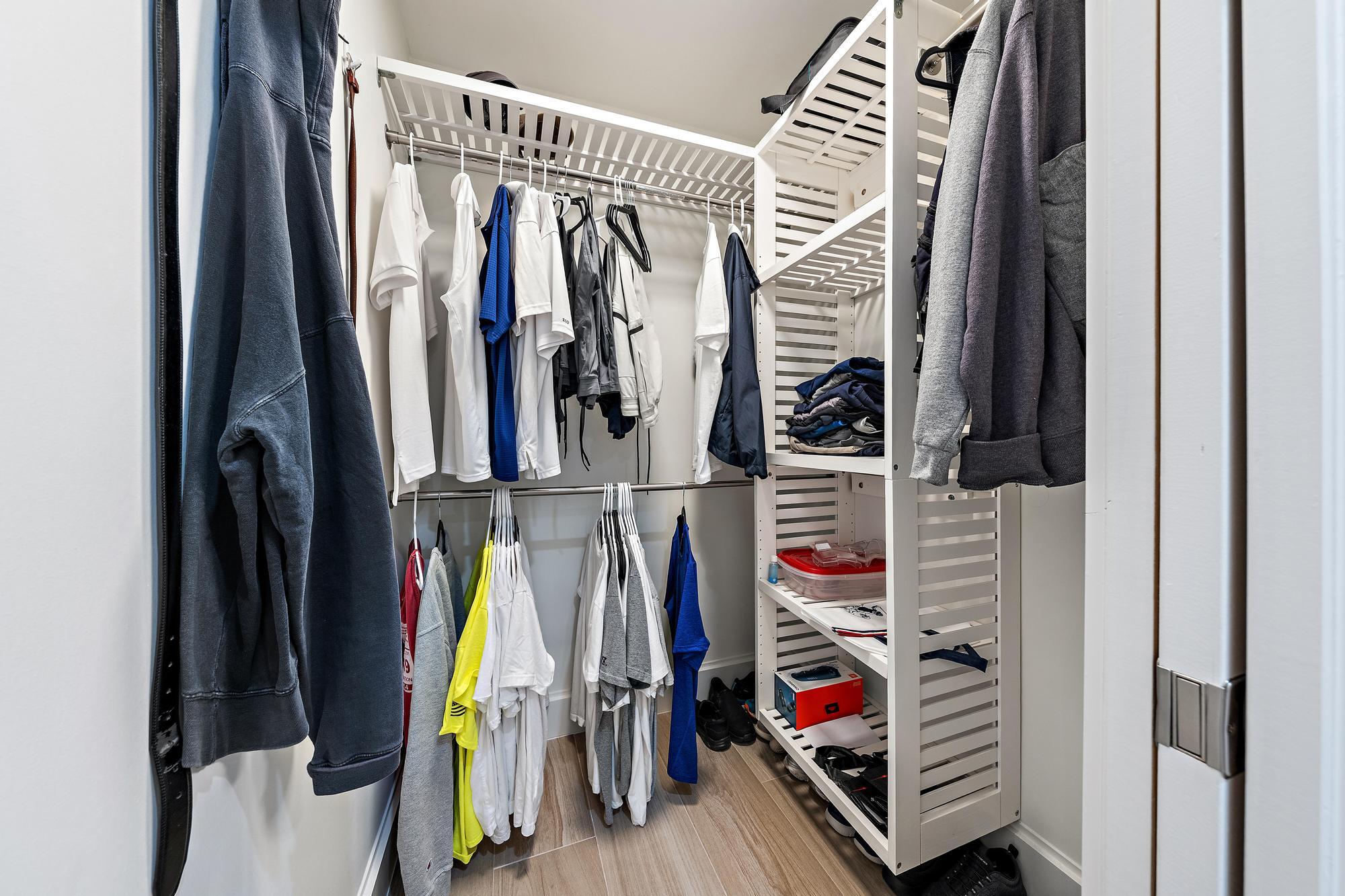 1120 Singer Drive Riviera Beach, FL 33404 - Photo 14 of 37 a view of walk in closet with clothes