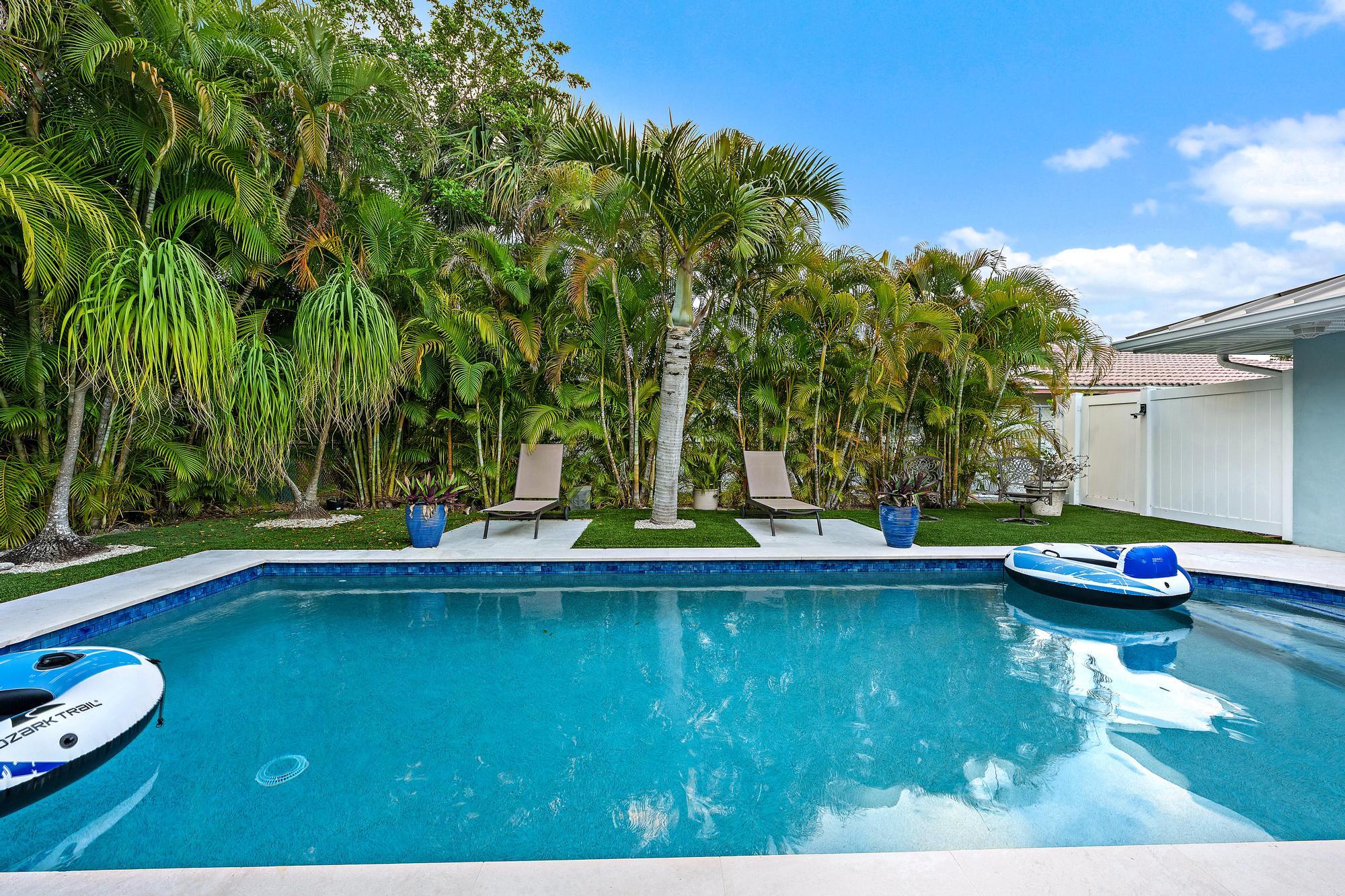 1120 Singer Drive Riviera Beach, FL 33404 - Photo 29 of 37 a view of swimming pool with lounge chair